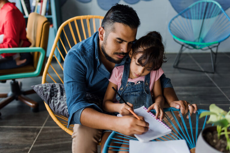 Adult Helping Child With Homework